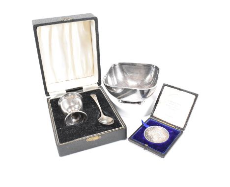 A collection of hallmarked silver and white metal items. The lot to include a Vintage cased Christening egg and spoon set. Th