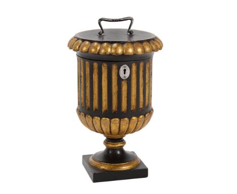 A Continental giltwood and ebonised tea caddy, 19th century, of fluted urn form, the steel handle to the lid enclosing a line