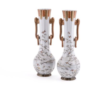 A pair of Japanese Kutani porcelain vases, the fluted baluster bodies with long tapering necks with ring handles, painted wit