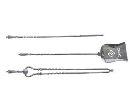 A set of three fire tools, 19th century, each with facetted handle above a twist and straight section shaft, the pierced shov