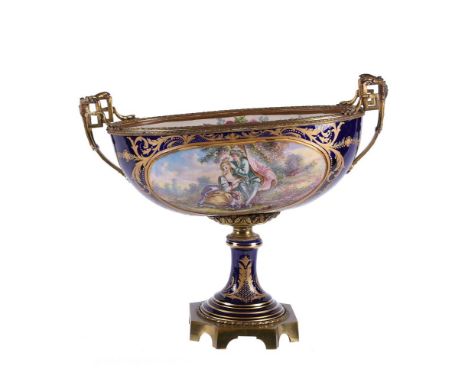 A large French pottery Sevres-style blue-ground navette-shaped centre bowl, first quarter 20th century, typically decorated w