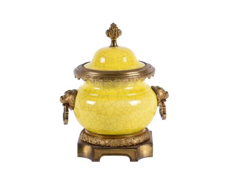 A Continental yellow crackled glazed pottery and gilt metal mounted urn and cover in the Chinese style, first quarter 20th ce