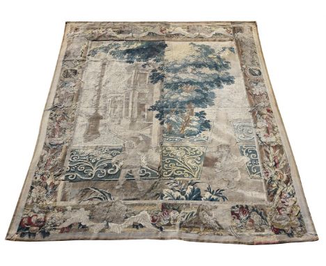 A verdure tapestry, formed of 18th century and later elements and adaptions, featuring a partial façade, foliage, and attenda