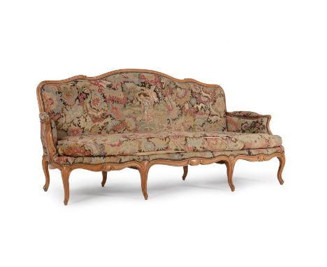 A beech and upholstered suite of seat furniture in Louis XV style, 20th century, comprising a sofa and a pair of armchairs, e