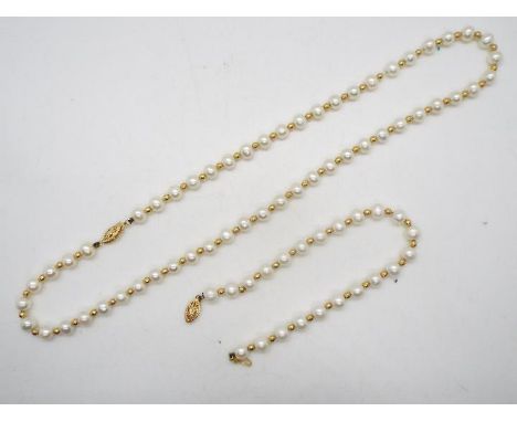 A yellow metal and pearl necklace and bracelet set, the clasp of each stamped 585 for 14ct, necklace approximately 44 cm (l)