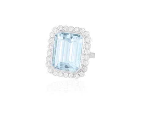 AN AQUAMARINE AND DIAMOND COCKTAIL RINGThe rectangular cut-cornered aquamarine weighing approximately 15.00cts within collet-