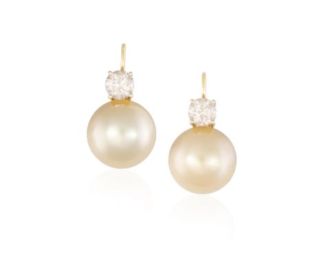 A PAIR OF CULTURED PEARL AND DIAMOND EARRINGSEach round button-shaped South Sea cultured pearl of gold tint, surmounted with 