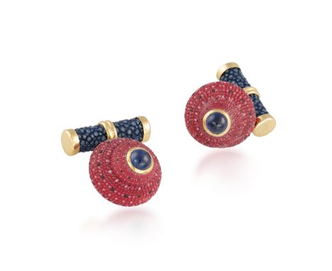 A PAIR OF SHELL, SAPPHIRE AND GOLD CUFFLINKS, BY TRIANONEach strawberry top shells set with a sapphire cabochon accents and s