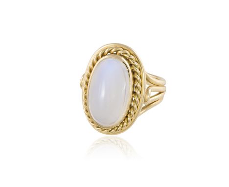 A MOONSTONE DRESS RINGThe oval-shaped cabochon moonstone, within a ropetwist gold frame, to a plain gold hoop, mounted in 14K