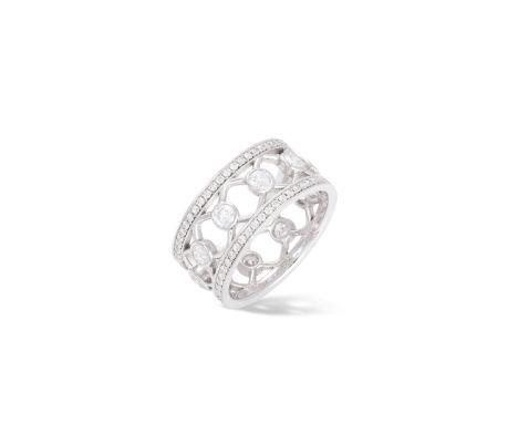 A DIAMOND RINGThe wide openwork band centrally set with collet-set round brilliant-cut diamonds, between pavé-set of similarl