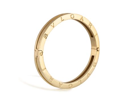 A 'B.ZERO' GOLD BANGLE, BY BULGARIThe polished ridged bangle with BVLGARI engraved around both sides, in 18K gold, signed, nu