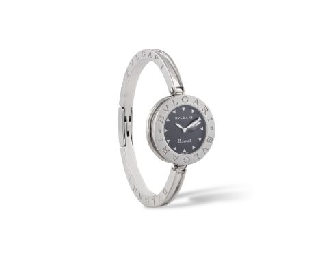 A STAINLESS STEEL BANGLE B.Zero1' WATCH, BY BULGARI, CIRCA 2010The 4-jewel quartz movement, with circular dial with triangle 