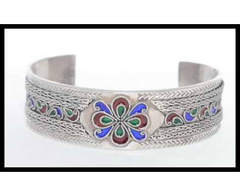 A heavey cloisonne and filigree deorated silver bangle. Stamped 925. Weight 43g