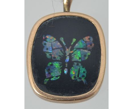 A 9ct gold vintage opal mosaic butterfly pendant. Marks worn. Measures 2cms x 1.3cms.Weight 1.2g.