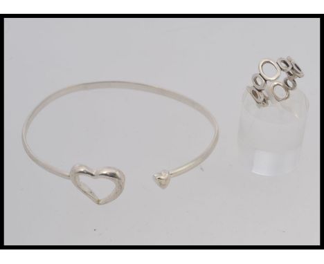 A designer heart clasp bangle together with a graduated bubble ring. Stamped 925. Ring size K.