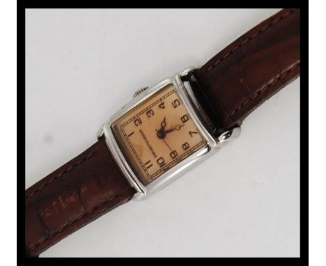 An Emporio Armani ladies dress watch with square face, caramel dial set to a leather strap. Model No AR0205