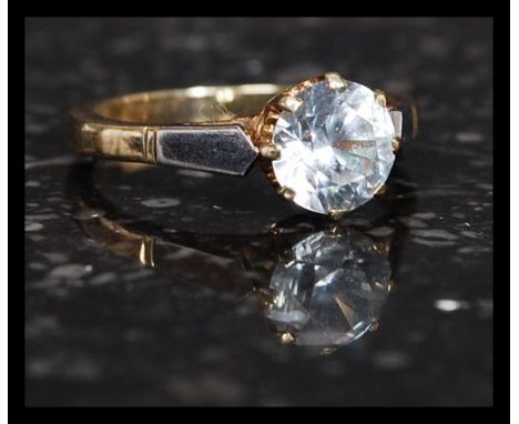 An early 20th century 9ct gold and platinum ring with large cushion cut white sapphire ? stone approx 1ct. Ring size K total 