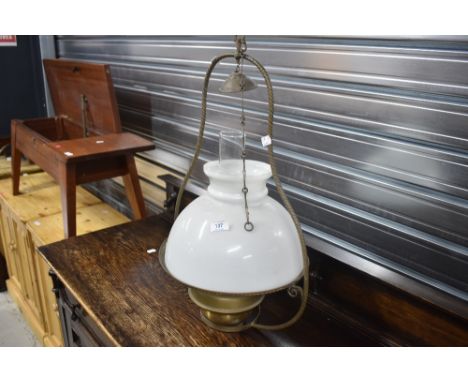 A traditional brass and glass oil type ceiling light fitting