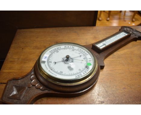 An early 20th Century oak cased aneroid barometer