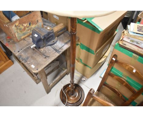 A traditional oak standard lamp