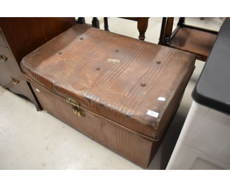 A traditional tin travel trunk, bearing 'Kendal' label to top