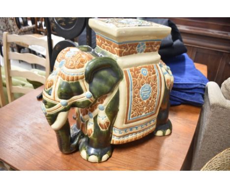 A traditional ceramic elephant garden seat