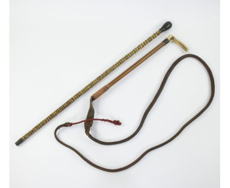 Dressage whip with bone handle and cane made from the tail of a pythonDressuurzweep met benen handgreep en wandelstok gemaakt