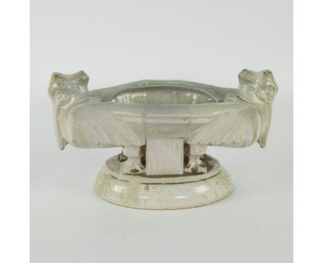 Art Deco planter circa 1925, signed Roger GUERIN, pelican model, in Bouffioulx sandstone (Belgium) and green enamellingArt De
