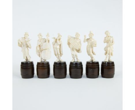 Orchestra of 6 ivory musicians standing on a wooden barrel, southern Germany, late 19th centuryOrkest van 6 ivoren muzikanten