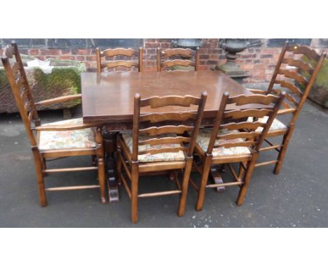 Oak pull out dining table together with set of six wavy ladder back chairs. Condition report: see terms and conditions