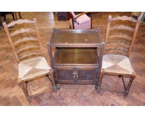Pair of oak ladder-back rush seated bedroom chairs and trolley Condition report: see terms and conditions