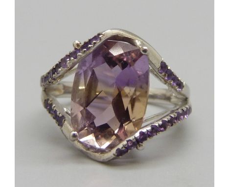 A large silver and pink stone ring, R 