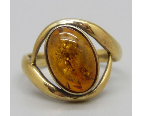A silver and amber ring, O 