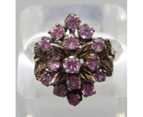 A large silver and pink stone cluster ring, T 