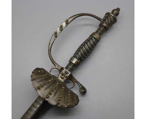 A 19th century dress sword, tapering triangle blade, etched with foliate patterns, leather and metal scabbard 