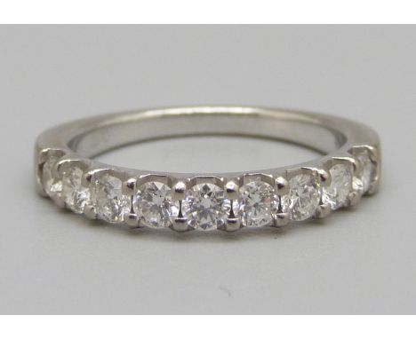 An 18ct white gold nine stone diamond ring, 4.1g, O, 0.77 carat weight marked in the shaft, colour FG, clarity VS, with 2014 