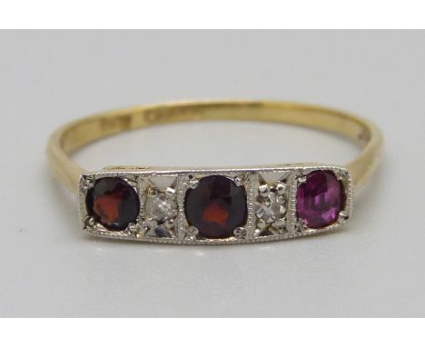 An Art Deco 18ct gold, garnet and diamond ring, 2g, T, one stone replaced 