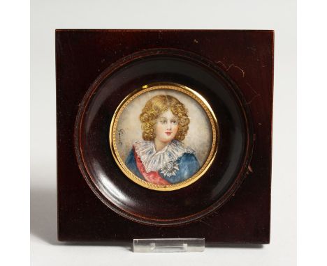 A CIRCULAR PORTRAIT MINIATURE OF A YOUNG BOY Signed Garet 2ins diameter in a wooden frame.