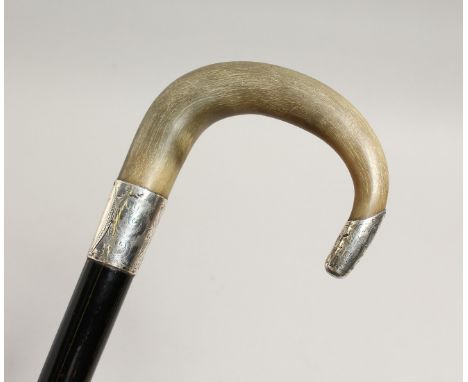 A SILVER MOUNTED WALKING STICK, late 19th / early 20th Century, the handle rhino horn