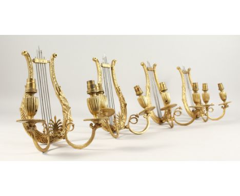 A VERY GOOD SET OF FOUR FRENCH ORMOLU, LYRE, TWO LIGHT WALL SCONCES with acanthus and anthemis. 10ins high.