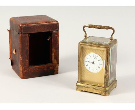 A GOOD 19TH CENTURY FRENCH BRASS REPEATER CARRIAGE CLOCK with engine turned face, black and white dial, movement no. 1995, in