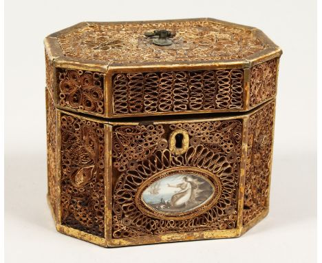 A GEORGE III ROLLED PAPER OCTAGONAL TEA CADDY inlaid with an oval. 5.5ins long.