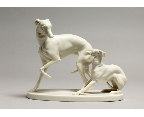 A GOOD NYMPHENBURG WHITE GLAZED PORCELAIN MODEL OF A WHIPPET AND PUP, AFTER P.J. MENE on an oval base, painted and impressed 