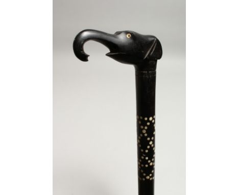 AN INLAID EBONY WALKING STICK, the handle as an elephant’s head 35ins long