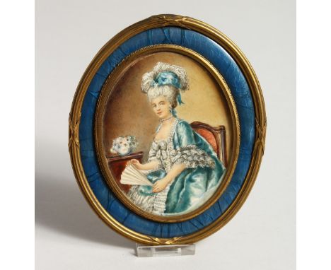 A VERY GOOD 19TH CENTURY FRENCH OVAL PORTRAIT OF A LADY holding a fan, in a blue enamel and ormolu frame. 6ins x 5ins