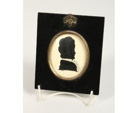 A LATE 9TH CENTURY SILHOUETTE PORTRAIT OF A LADY, framed oval, in an ebony frame. 5ins x 4.25ins.
