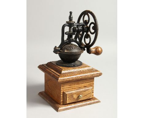 AN OLD COFFEE GRINDER