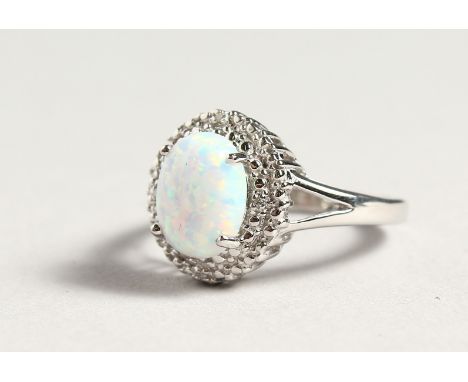A SILVER OPALITE AND DIAMOND CLUSTER RING