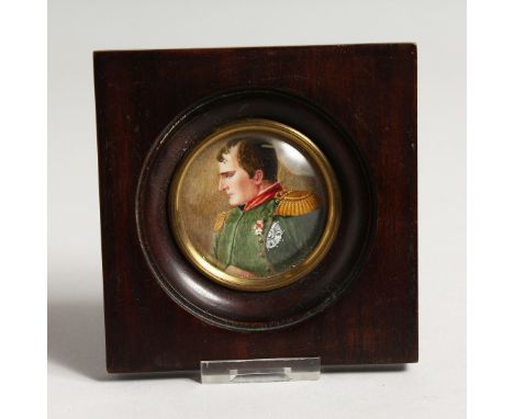 A CIRCULAR PORTRAIT MINIATURE OF NAPOLEAN 2ins diameter in a wooden frame.