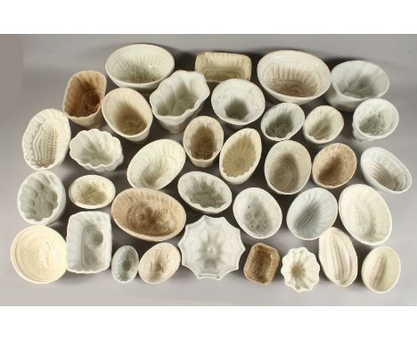 A COLLECTION OF THIRTY FIVE LATE VICTORIAN CERAMIC JELLY MOULDS.